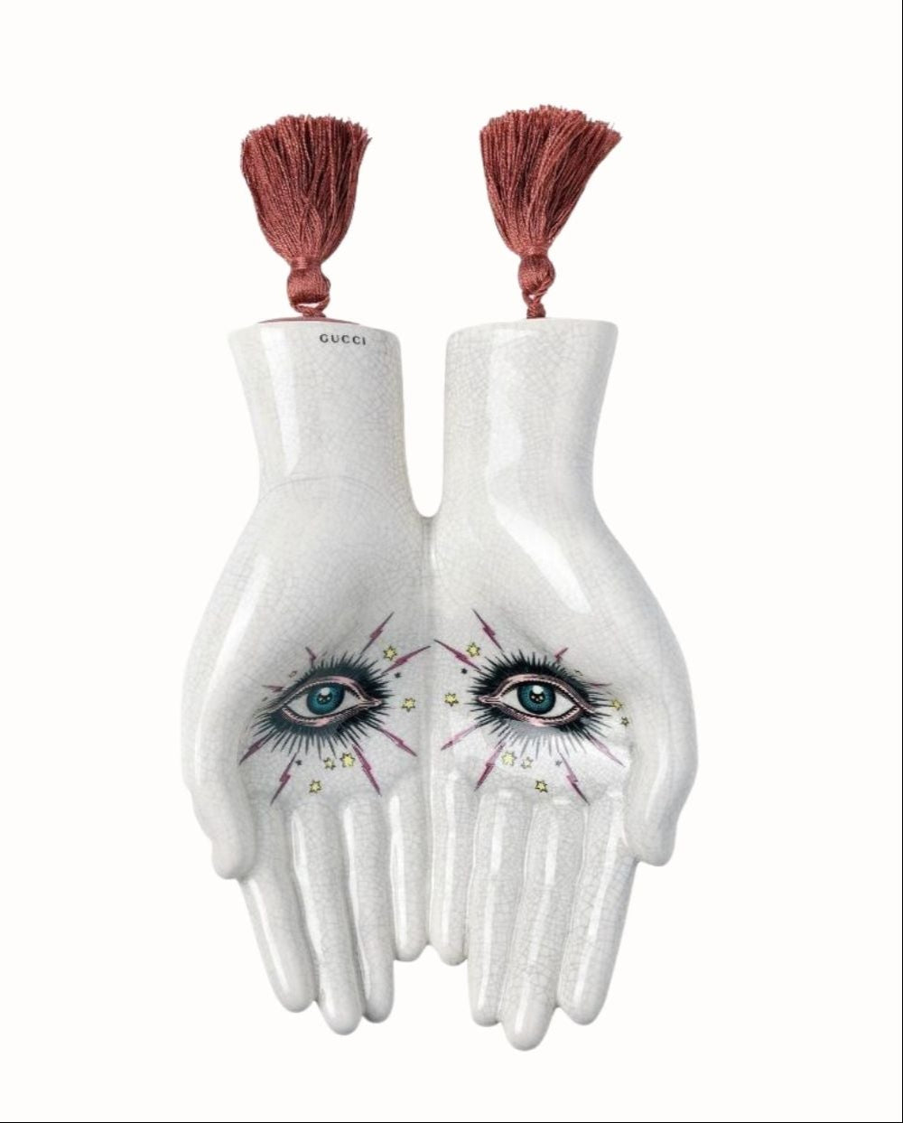 Alessandro Michele's eye design for Gucci - catchall with two hands and eyes with tassles.