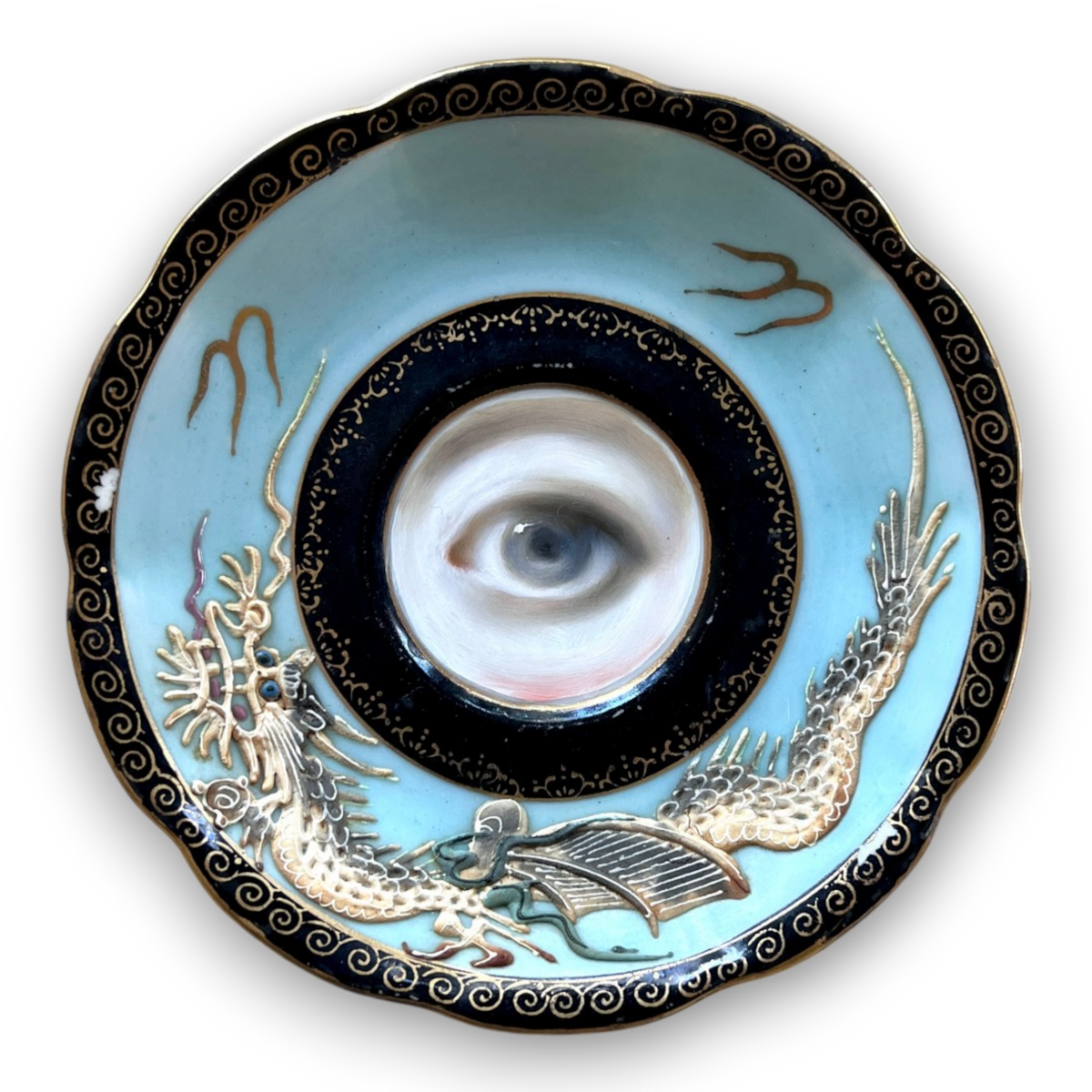 No. 3896 Lover’s Eye Painting on a Blue Dragonware Plate