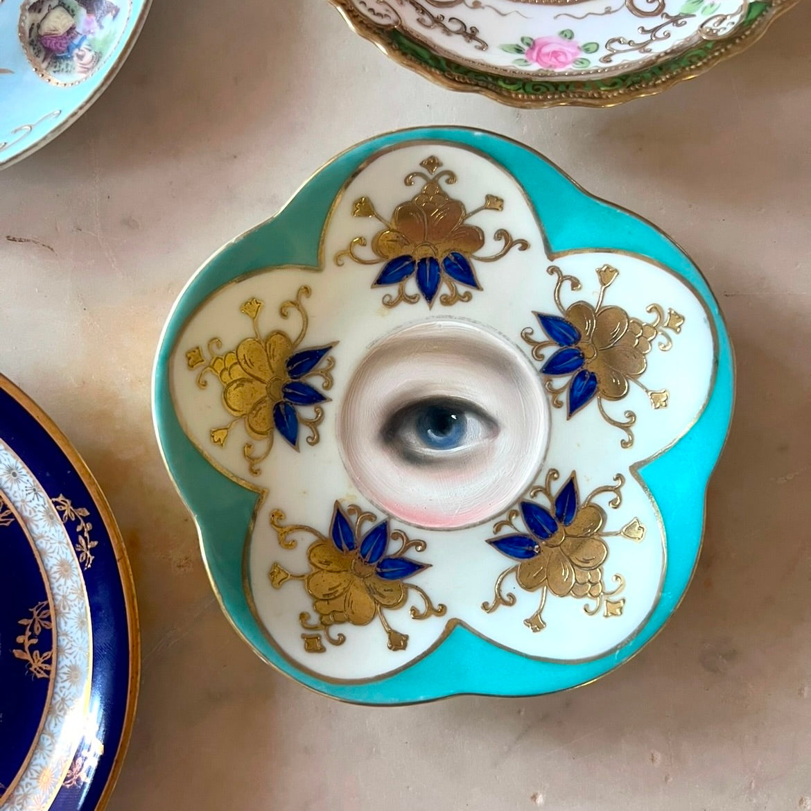 No. 2772 Lover's Eye Painting on a Mini Blue Flower Plate
