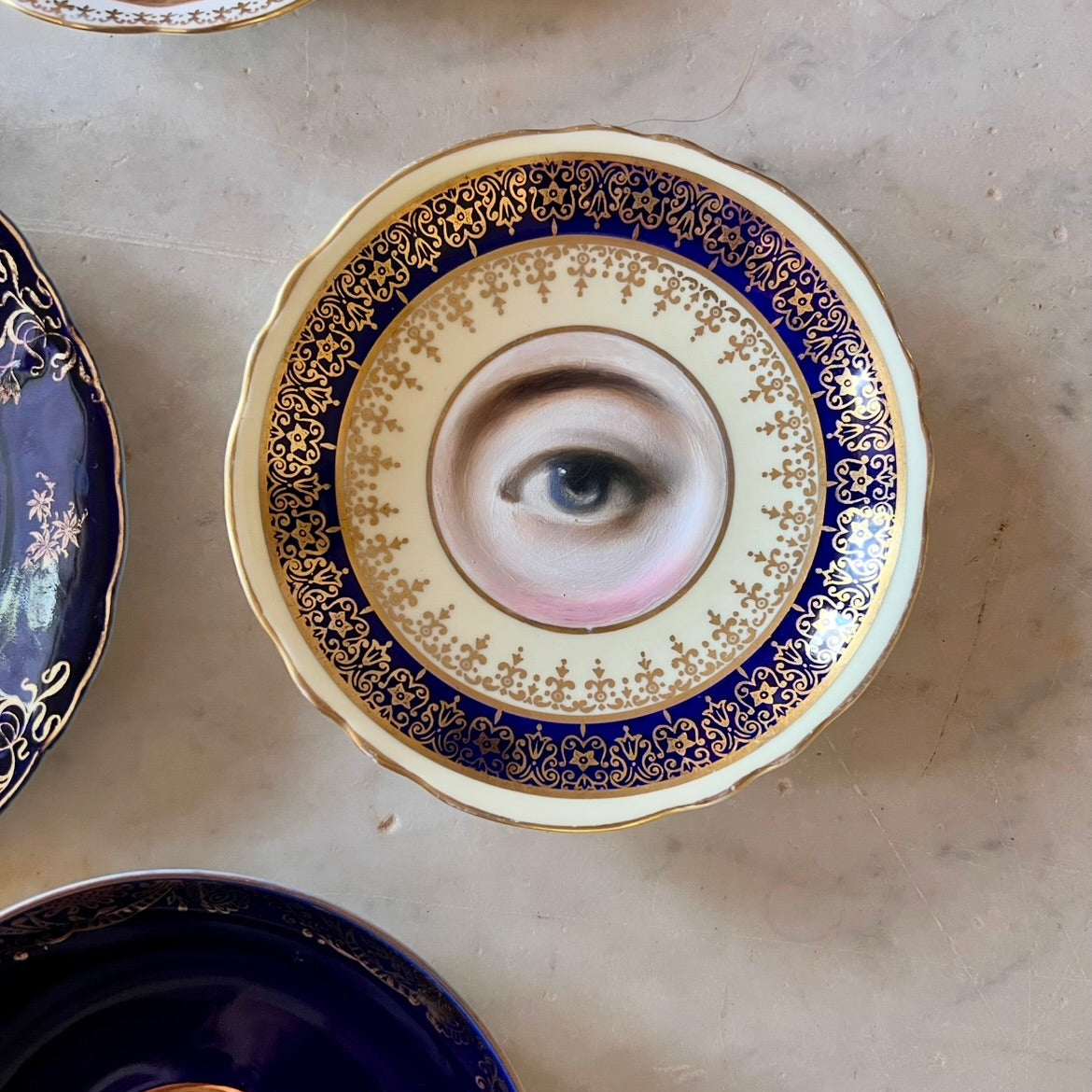 No. 2783 Lover's Eye Painting on an English Blue, Cream, and Gold Plate