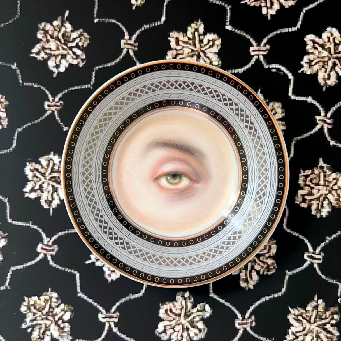 No. 2908 Lover's Eye Painting of Salman Rushdie on a Black, Silver, & Gold Plate
