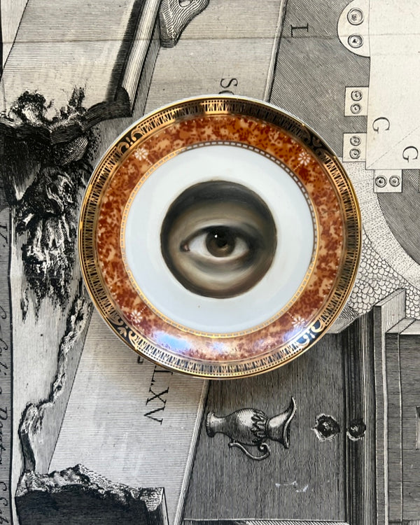 Lover's Eye Paintings on a Mottled Brown, Black, and Gold Plate